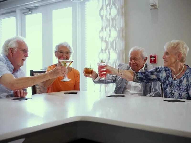 four residents toasting